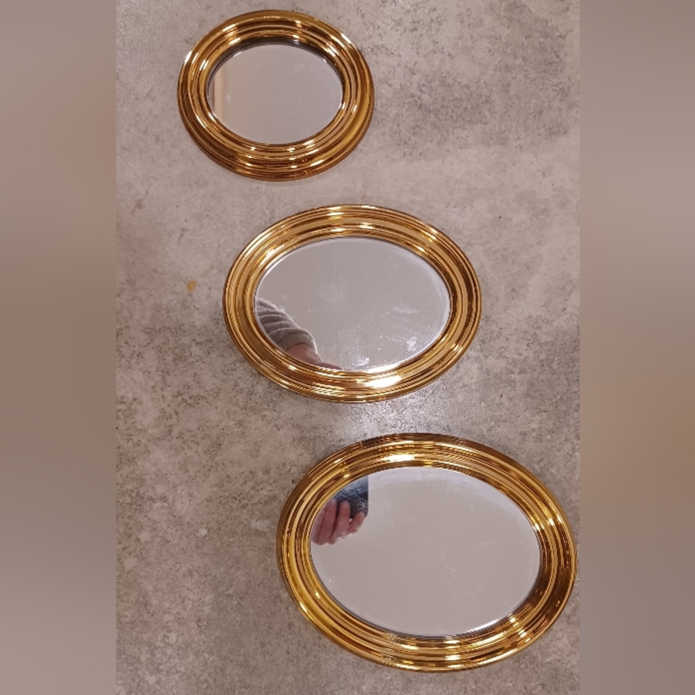 Three Gold Oval Mirrors